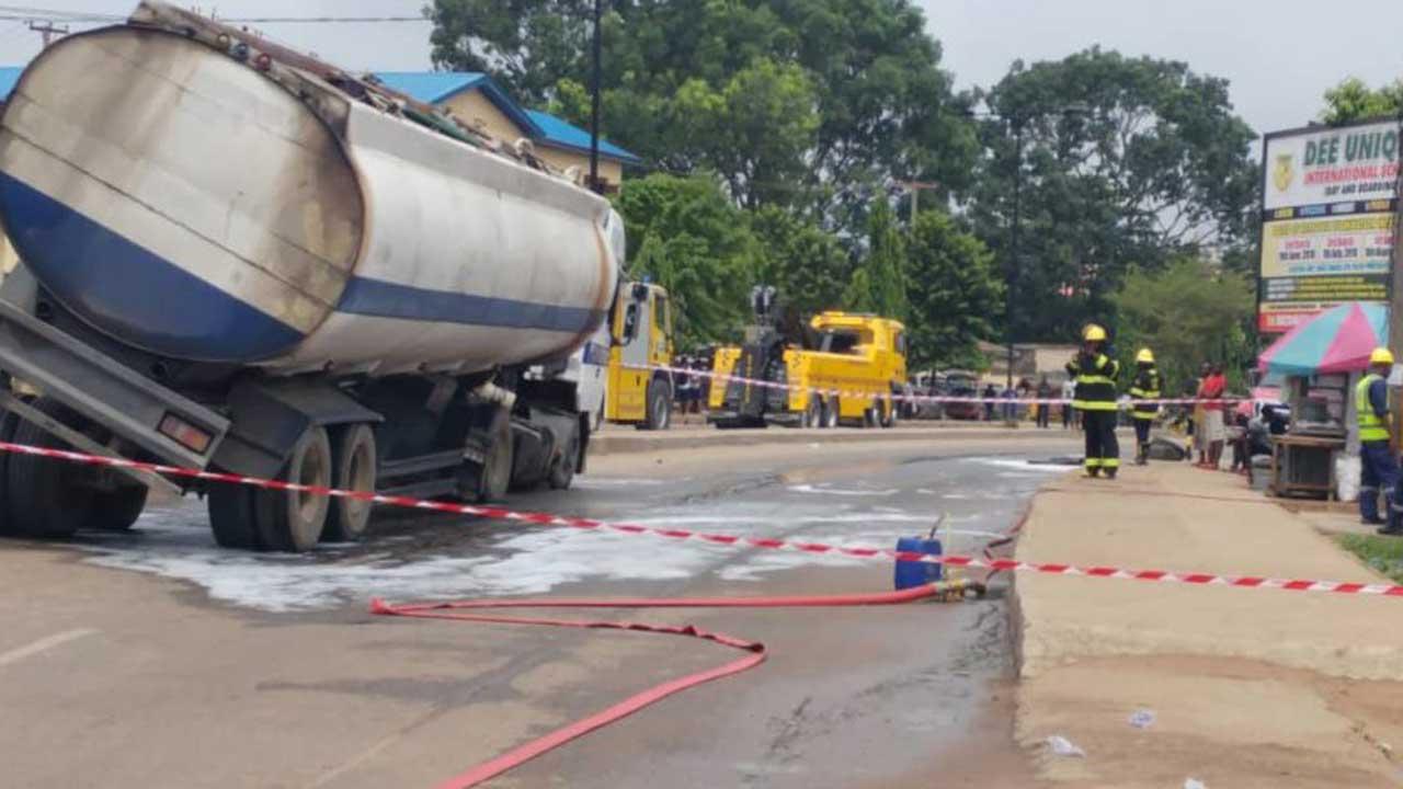 Ticking time bomb: Desperate Delta residents scoop petrol from leaking tanker