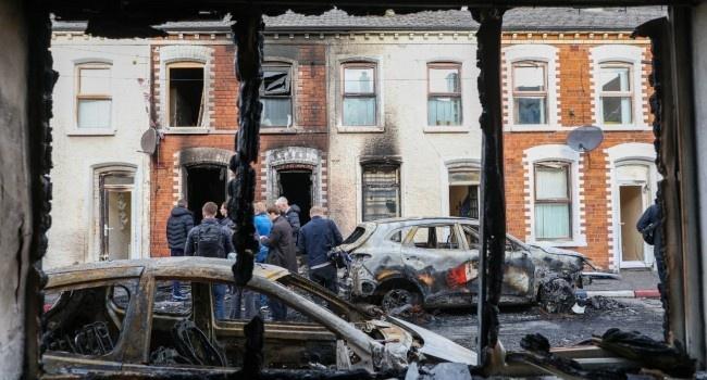 Protesters Torch Buildings And Vehicles, Block Roads Over Belfast Stabbing